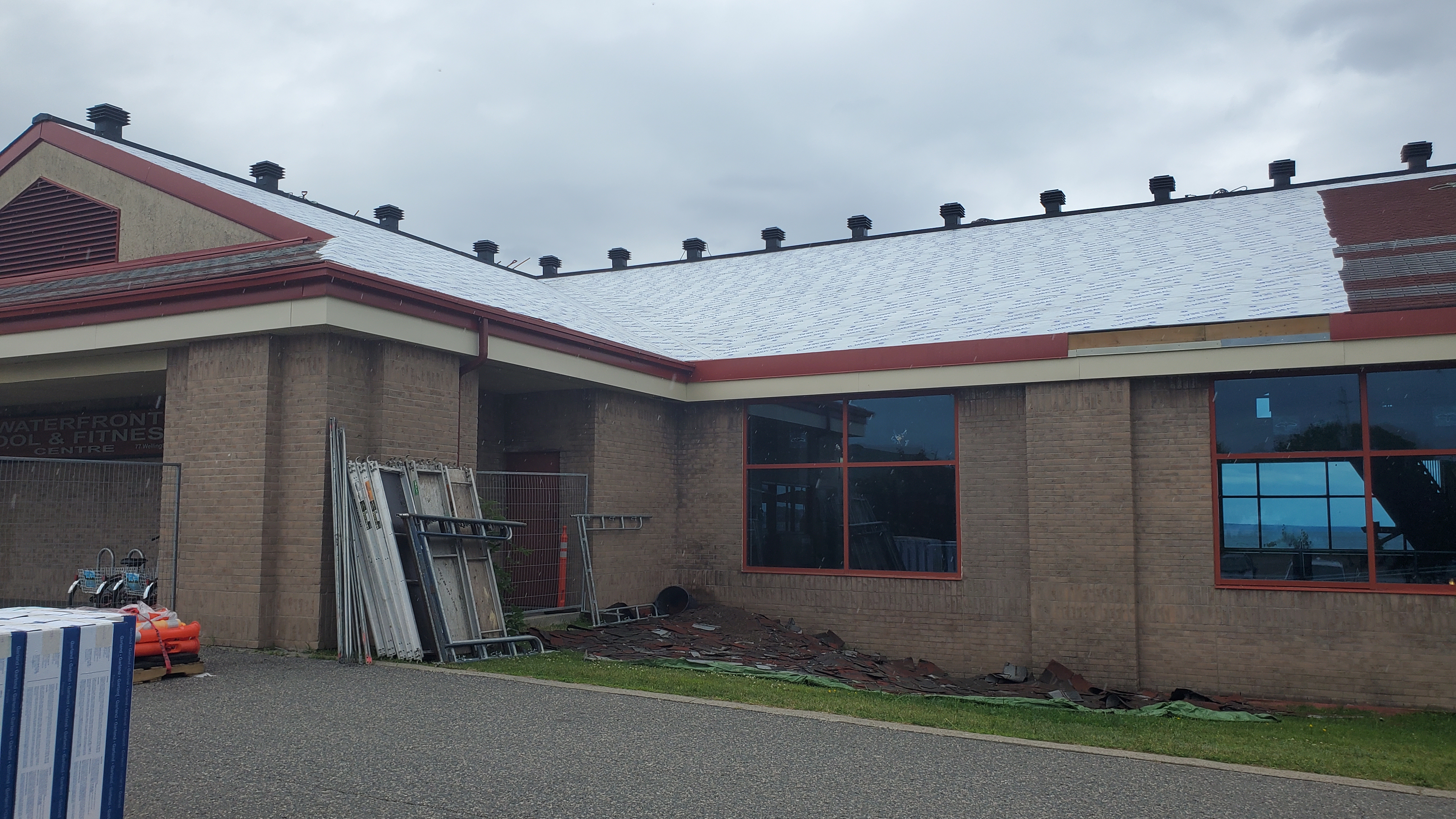 Exterior image of the PFC with part of the shingles removed and roof underlay visible